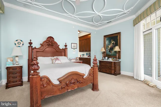 a aerial view of a house with swimming pool next to a big yard