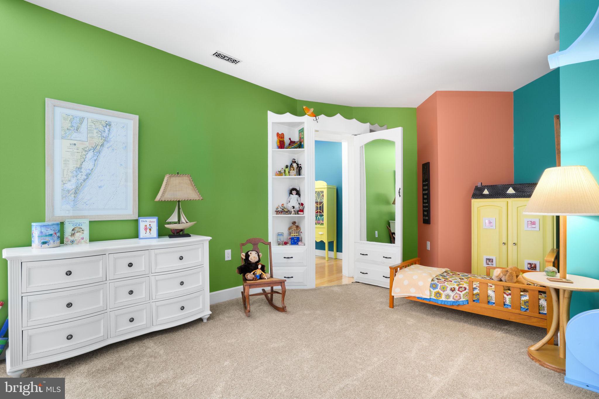 6513 Hampton Road Berlin, MD 21811 - Photo 63 of 129 a bedroom with a bed and a table in it