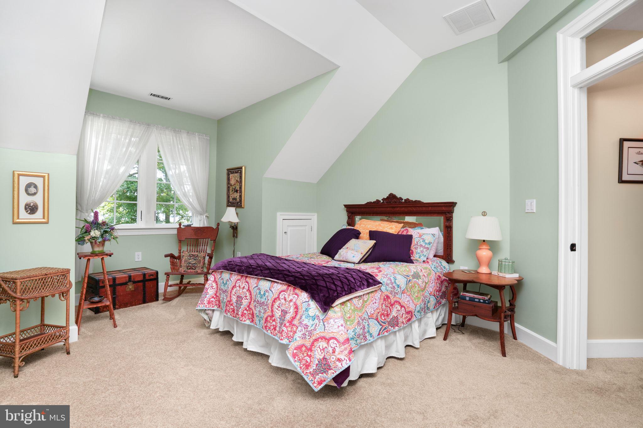 6513 Hampton Road Berlin, MD 21811 - Photo 69 of 129 a bedroom with a bed and a chandelier