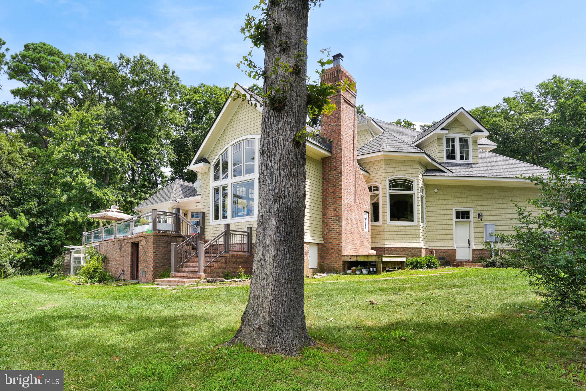 6513 Hampton Road Berlin, MD 21811 - Photo 95 of 129 a front view of a house with a garden and plants