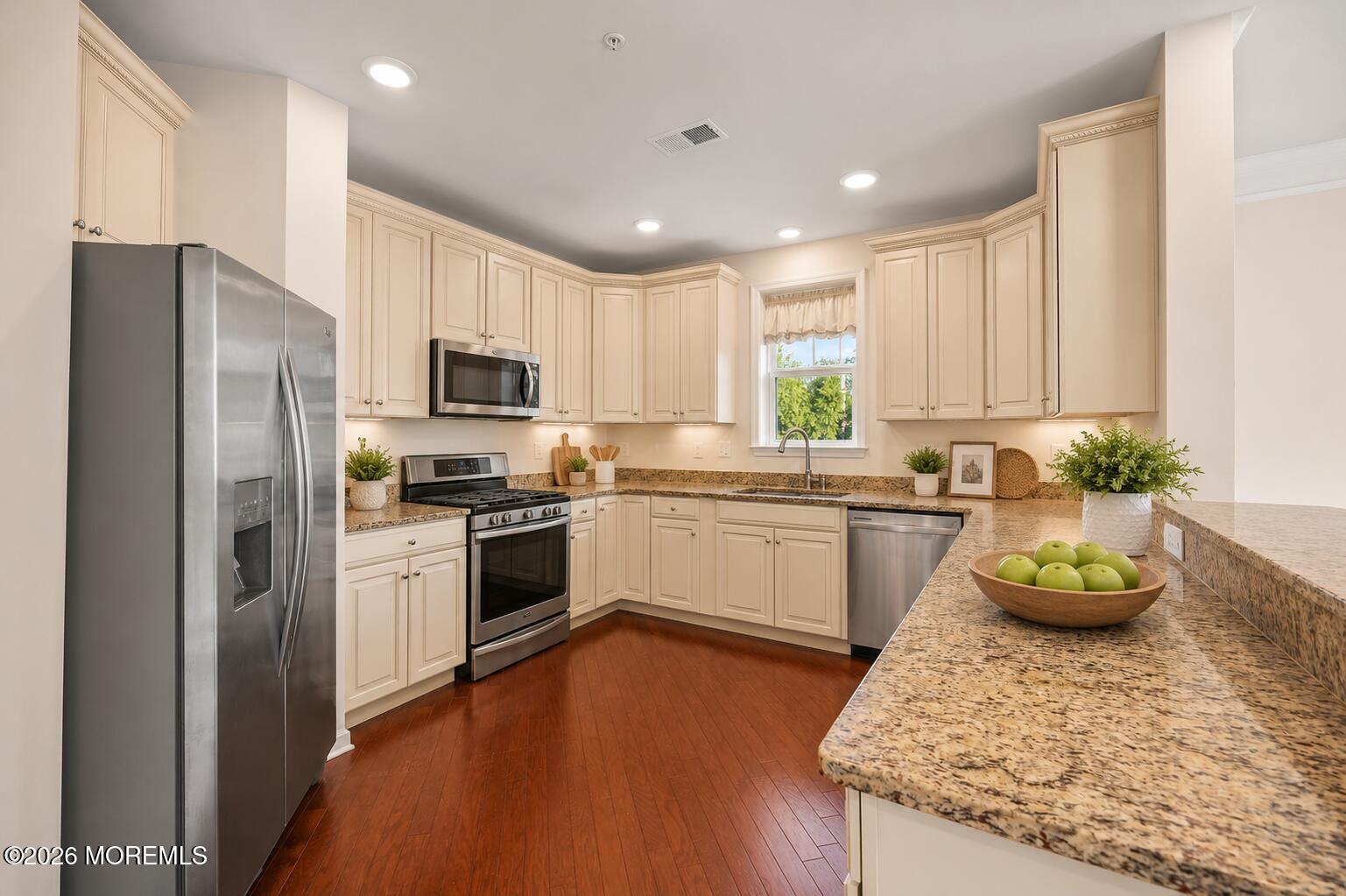 2201 River Road, Unit 4207 Point Pleasant, NJ 08742 - Photo 5 of 34 a kitchen with a sink stainless steel appliances and cabinets