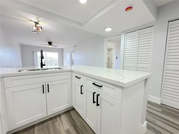 a bathroom with a sink vanity and mirror