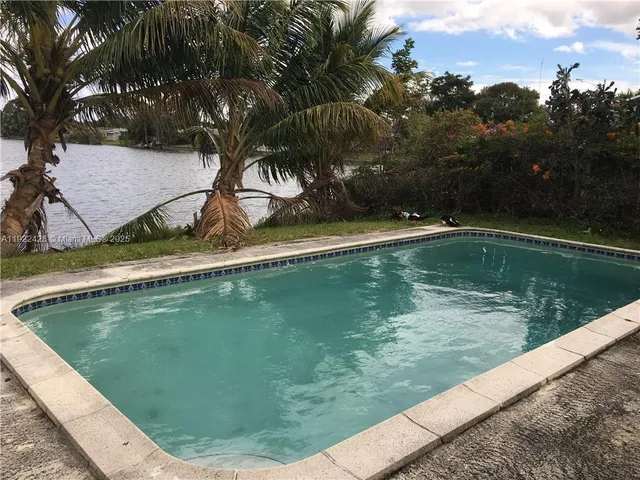 a view of a swimming pool with a lake