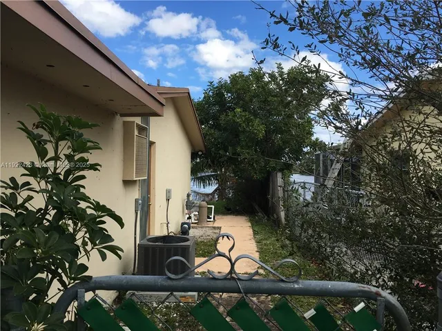 a kitchen with a sink and washing machine