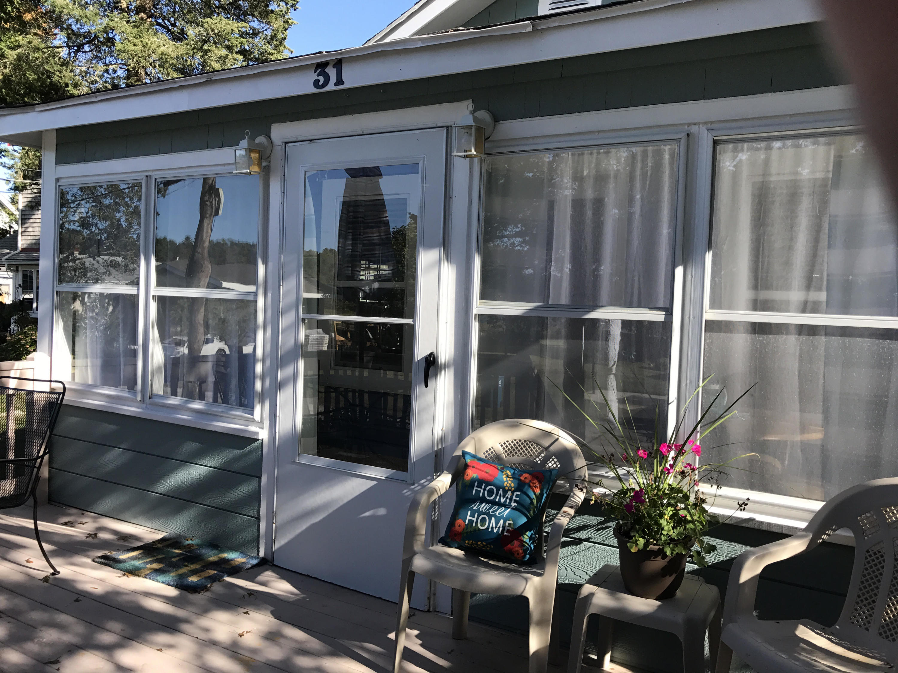 31 Agawam Beach Road Wareham, MA 02571 - Photo 3 of 14 a front view of a house with a porch