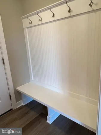 a white toilet sitting next to a bathroom sink