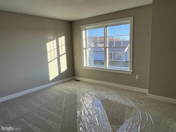 an empty room with an empty space and a window
