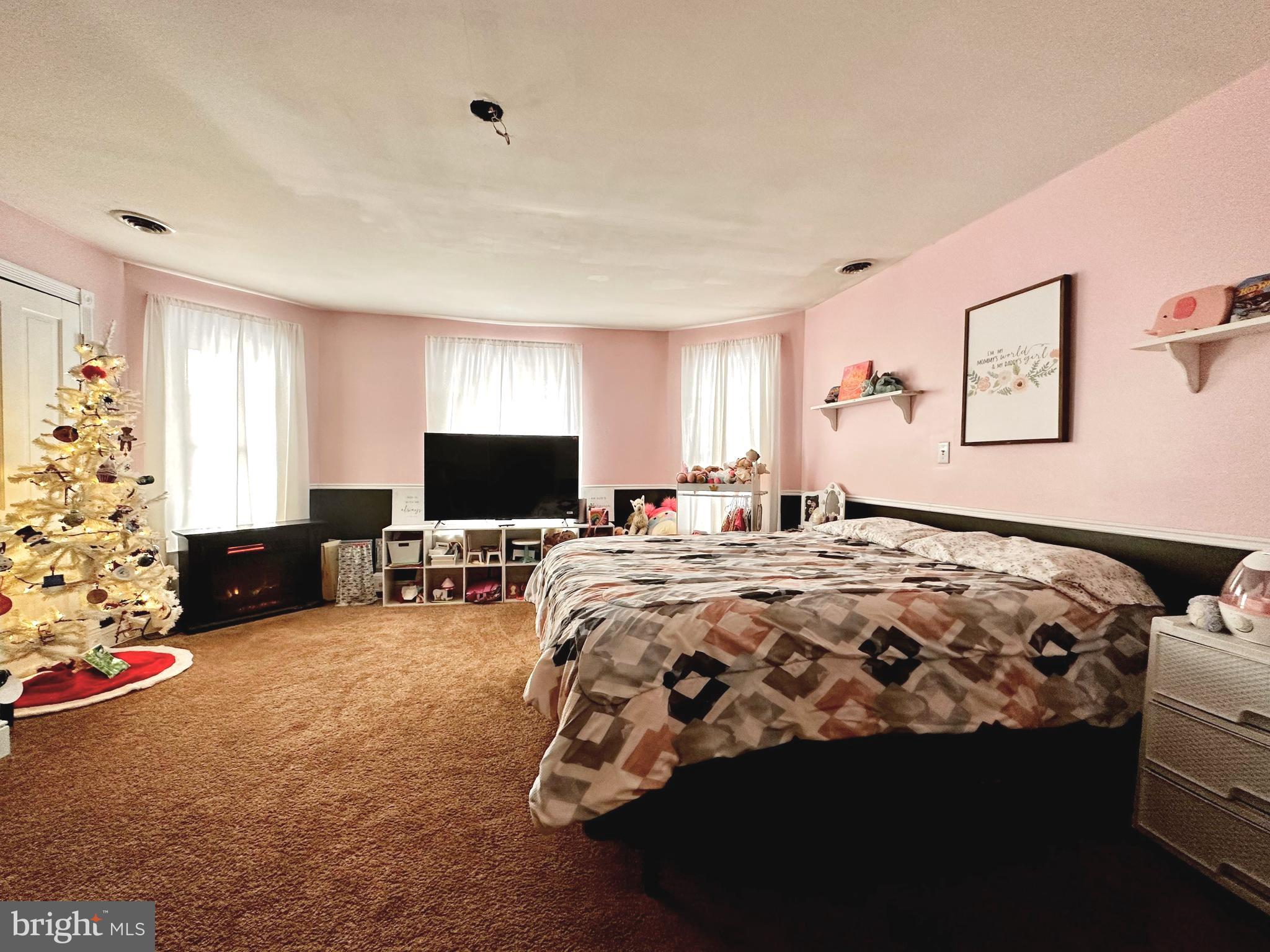 210 Old Line Road Goldsboro, MD 21636 - Photo 15 of 27 a bedroom with bed couch and window