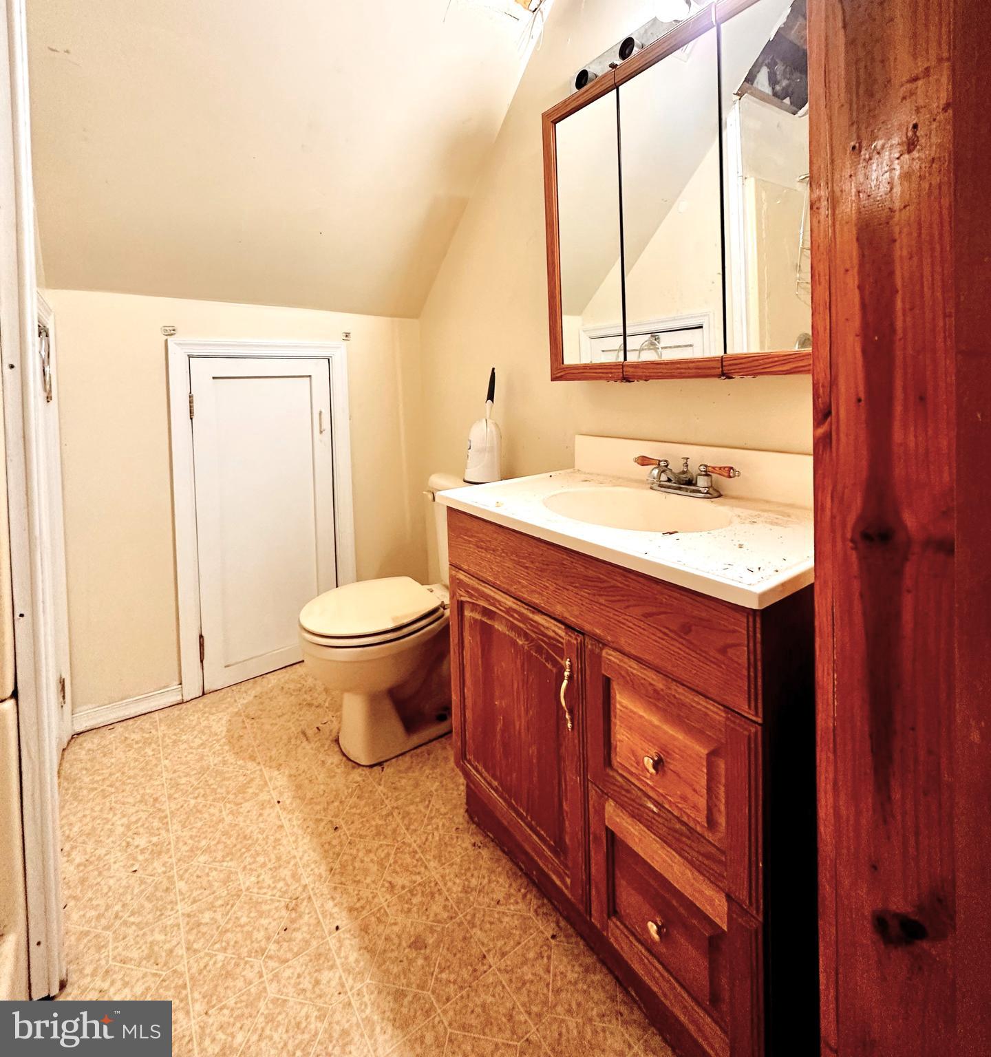 210 Old Line Road Goldsboro, MD 21636 - Photo 24 of 27 a bathroom with a granite countertop sink toilet and mirror