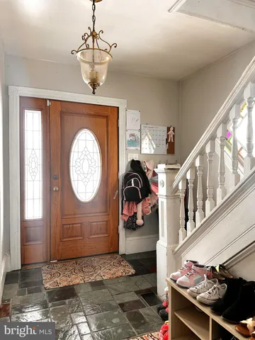 a view of a entryway door with wooden floor