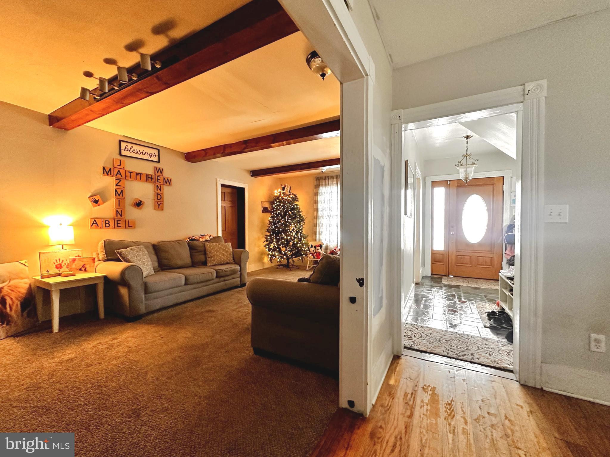 210 Old Line Road Goldsboro, MD 21636 - Photo 9 of 27 a living room with furniture and a fireplace