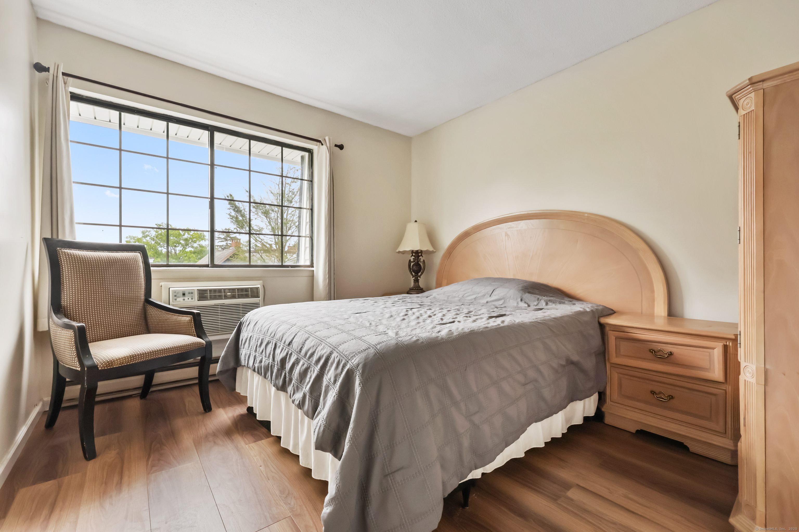 187 Flax Hill Road, Unit D5 Norwalk, CT 06854 - Photo 12 of 19 a bedroom with a bed and a window