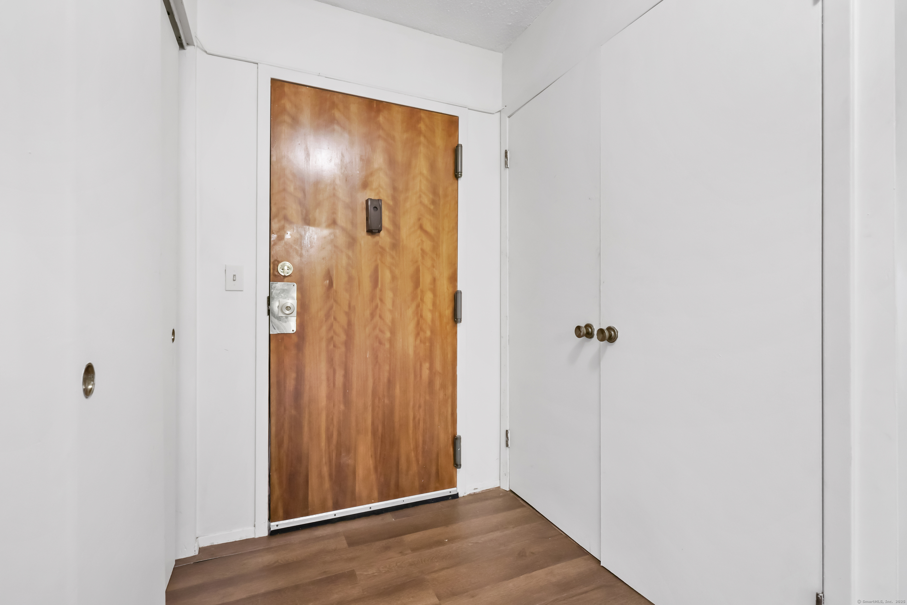 187 Flax Hill Road, Unit D5 Norwalk, CT 06854 - Photo 3 of 19 a view of elevator with wooden floor