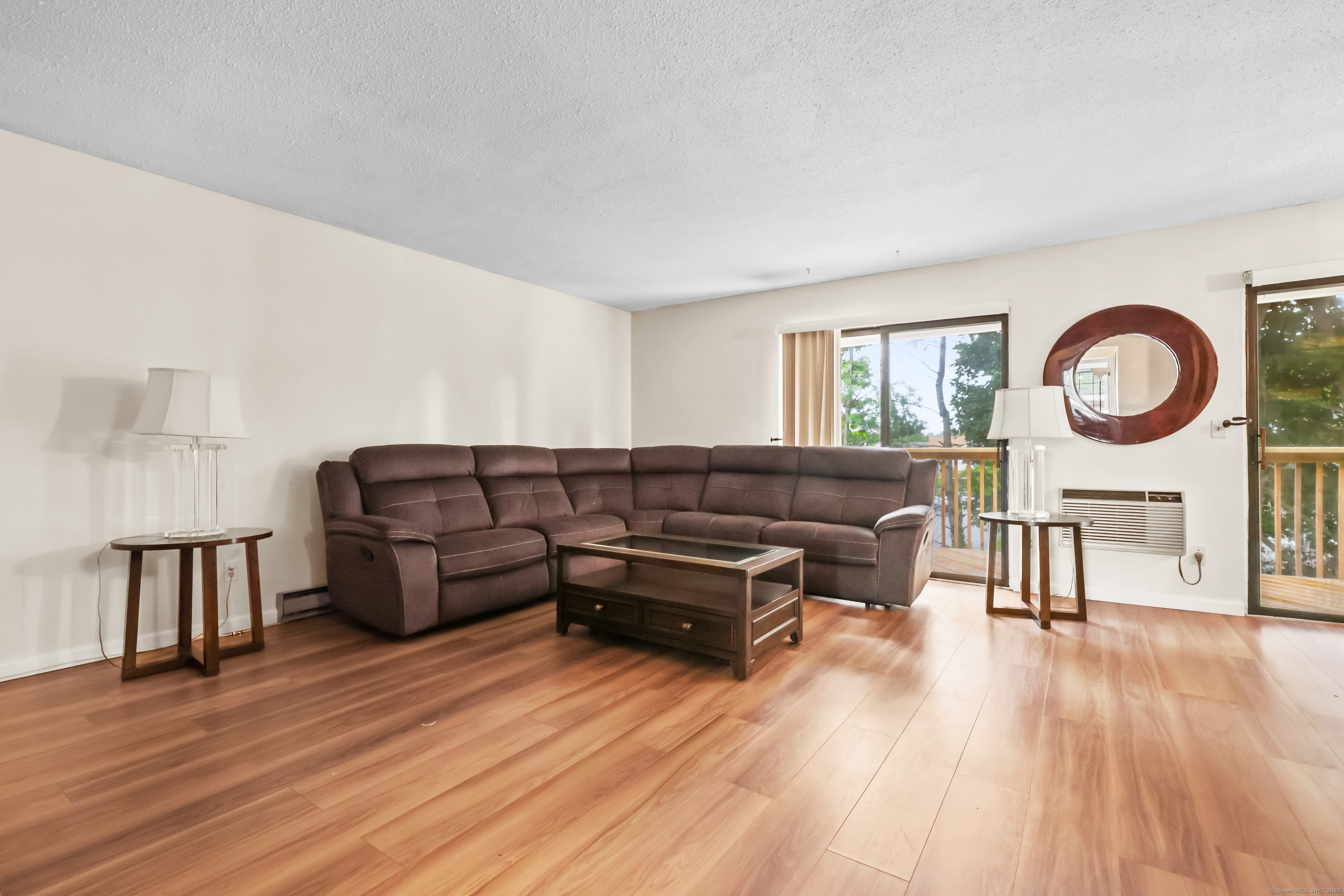 187 Flax Hill Road, Unit D5 Norwalk, CT 06854 - Photo 4 of 19 a living room with furniture and a wooden floor