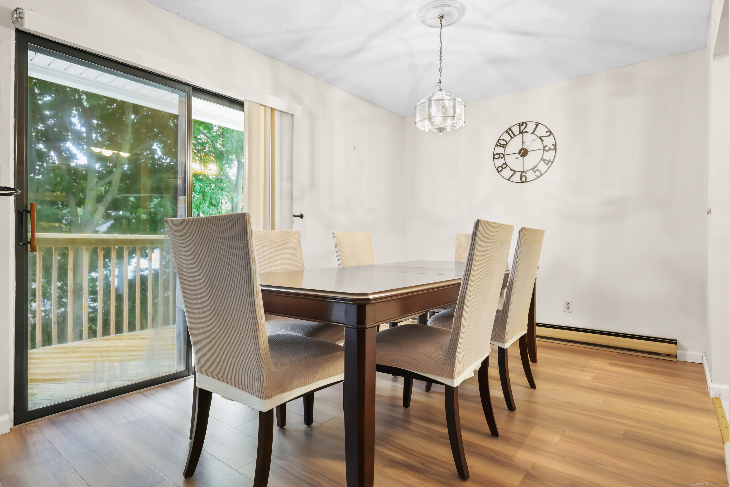 187 Flax Hill Road, Unit D5 Norwalk, CT 06854 - Photo 6 of 19 a view of a dining room with furniture window and wooden floor