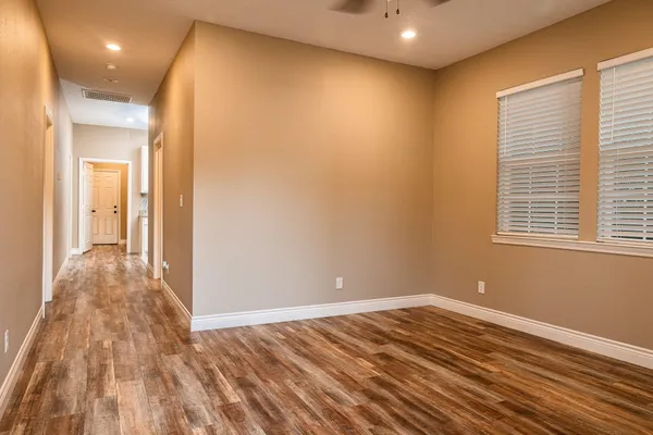 a view of a livingroom with wooden floor