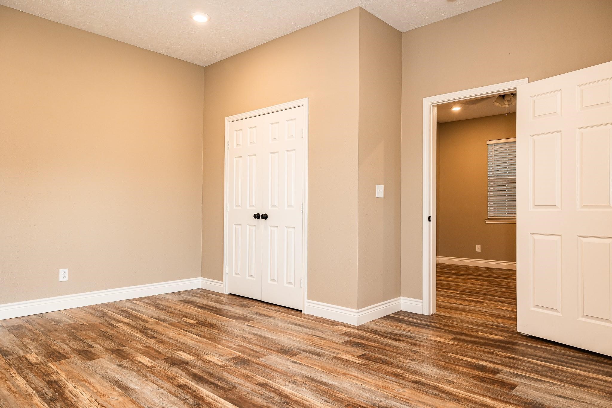 1306 South Austin Street Brenham, TX 77833 - Photo 5 of 16 a view of a livingroom with wooden floor and closet