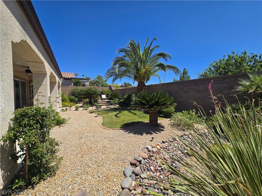 2567 Dirleton Place Henderson, NV 89044 - Photo 60 of 67 A private, low-maintenance yard offers serene landscaping and mature palm trees.