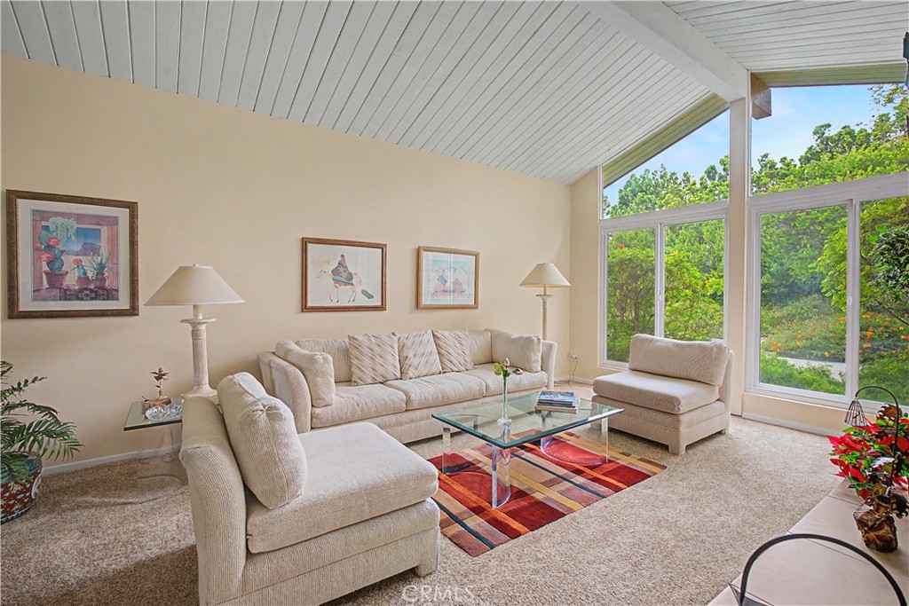 22671 Town Crier Road Calabasas, CA 91302 - Photo 26 of 35 a living room with furniture and a large window