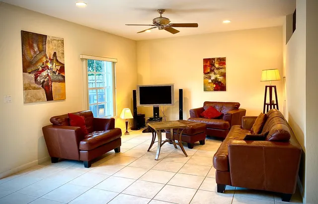 a living room with furniture and a flat screen tv