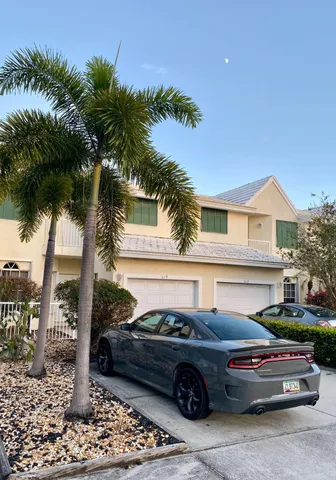 a front view of a house with parking