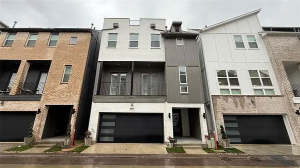 a front view of a house with a garage