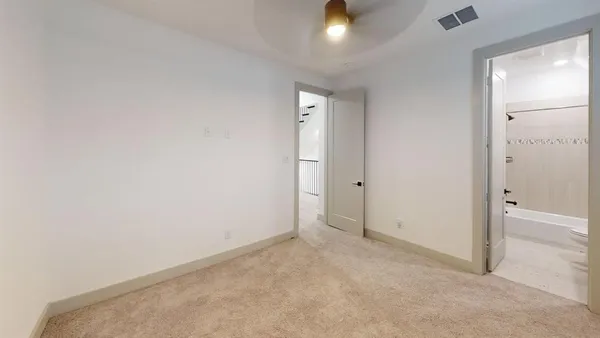 an empty room with closet area