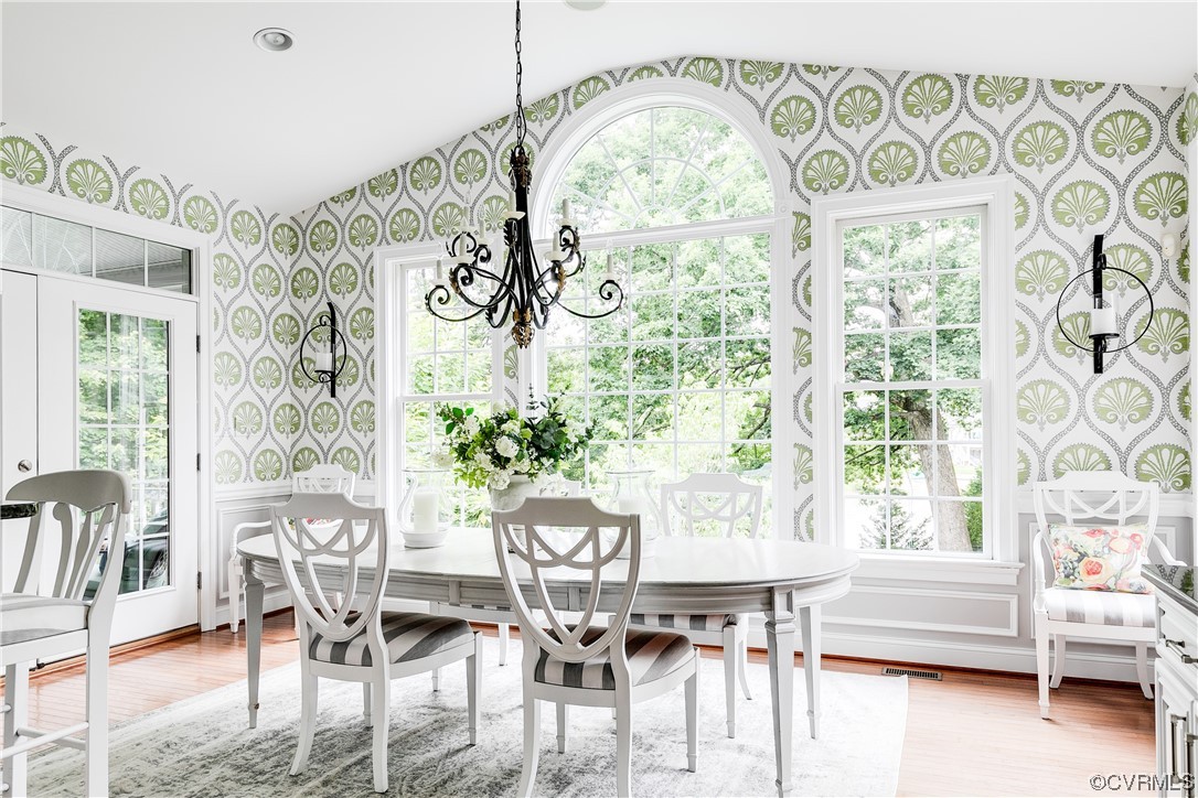 508 Raleigh Manor Road Henrico, VA 23229 - Photo 12 of 25 a view of a dining room with furniture wooden floor and a chandelier