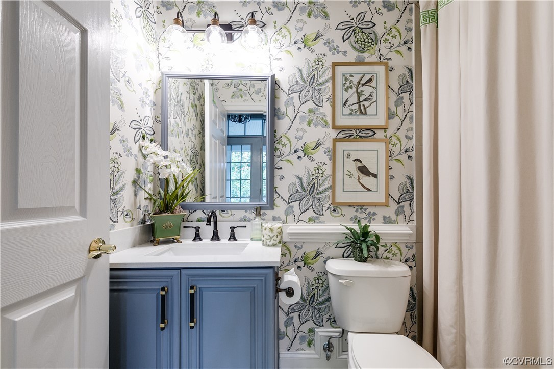 508 Raleigh Manor Road Henrico, VA 23229 - Photo 8 of 25 a bathroom with a toilet sink and mirror