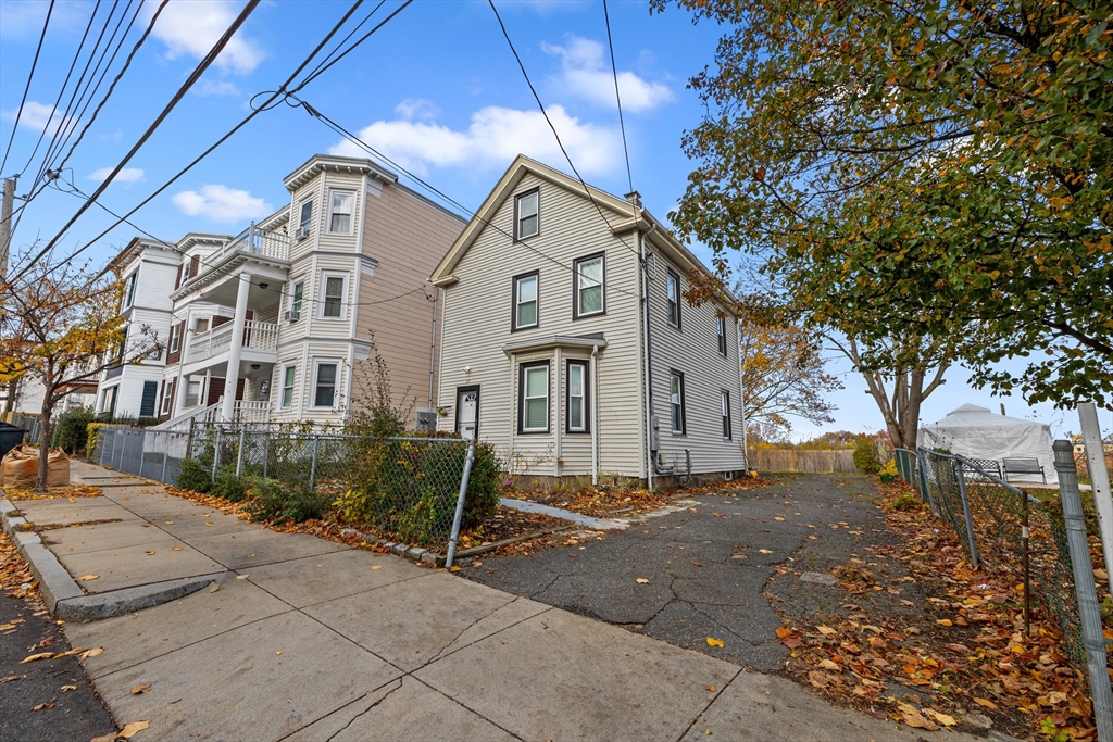 20 Rosseter Street Boston, MA 02121 - Photo 18 of 24 a view of a house with a yard