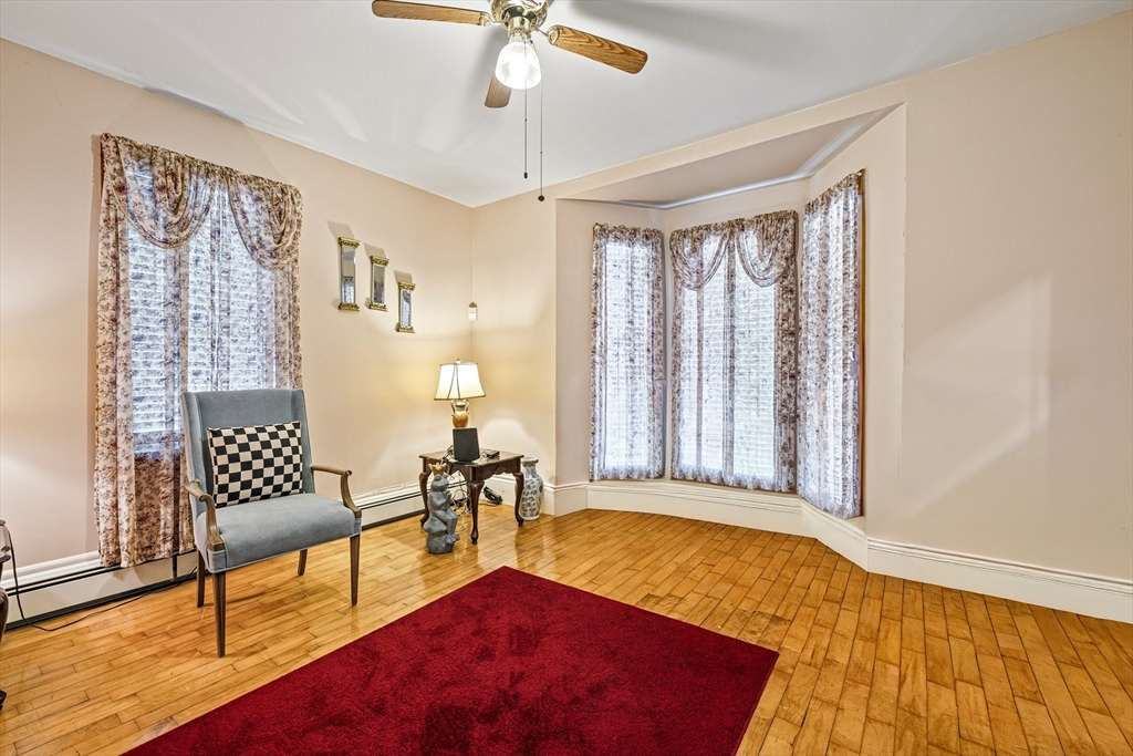 20 Rosseter Street Boston, MA 02121 - Photo 2 of 24 a living room with furniture and a rug