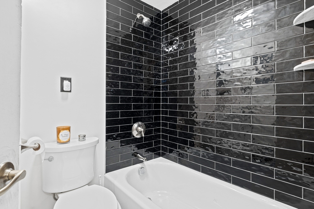 20 Rosseter Street Boston, MA 02121 - Photo 8 of 24 a bathroom with a sink toilet and shower