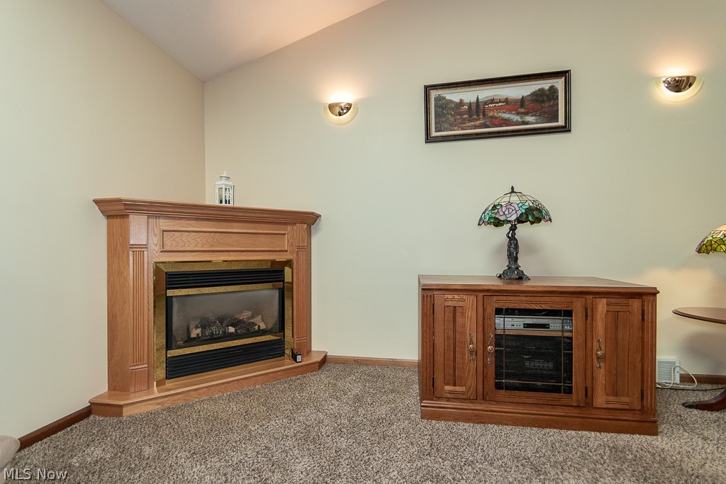 320 Harbor Ridge Lane Fairport Harbor, OH 44077 - Photo 5 of 38 Close up view of the vaulted Great Room with corner gas fireplace & much room for all of your personal touches!