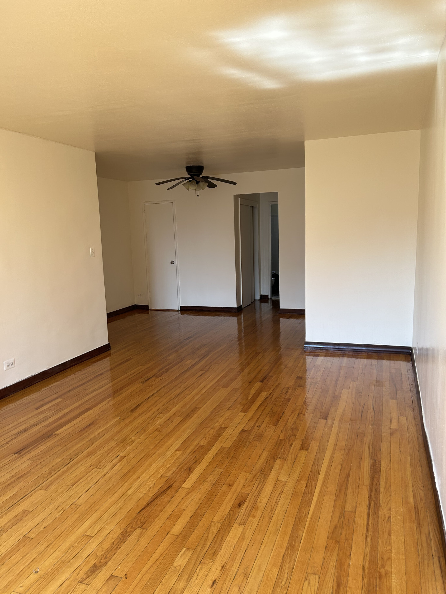 2385 Barker Avenue, Unit 5L Bronx, NY 10467 - Photo 2 of 15 a view of a room with wooden floor