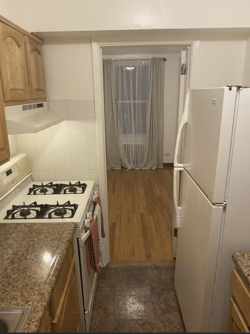 2385 Barker Avenue, Unit 5L Bronx, NY 10467 - Photo 5 of 15 a kitchen with a stove and a refrigerator
