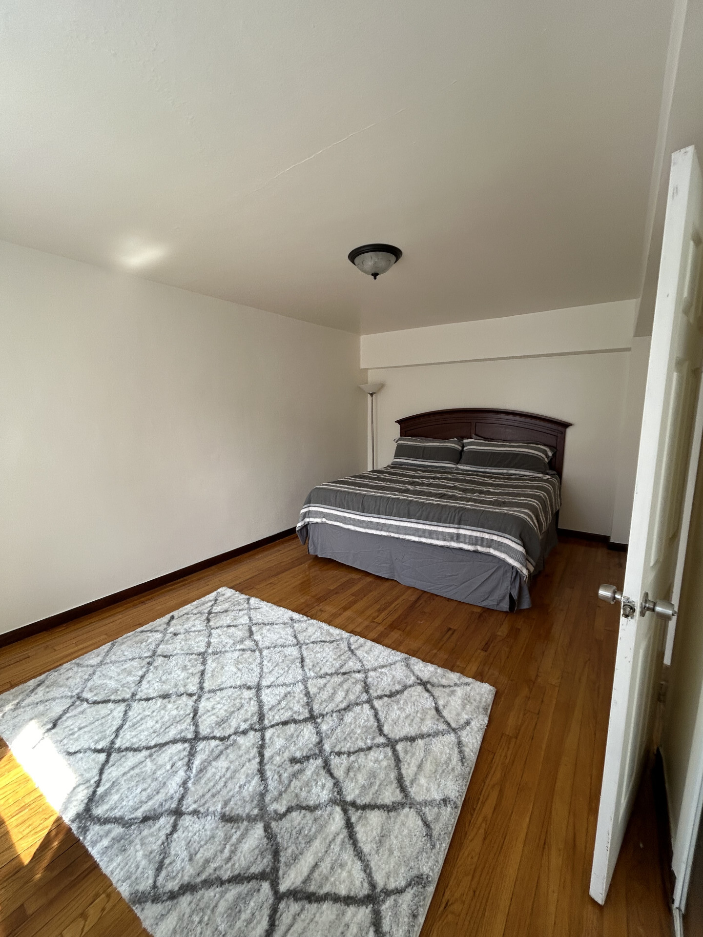 2385 Barker Avenue, Unit 5L Bronx, NY 10467 - Photo 6 of 15 a view of an empty room and wooden floor