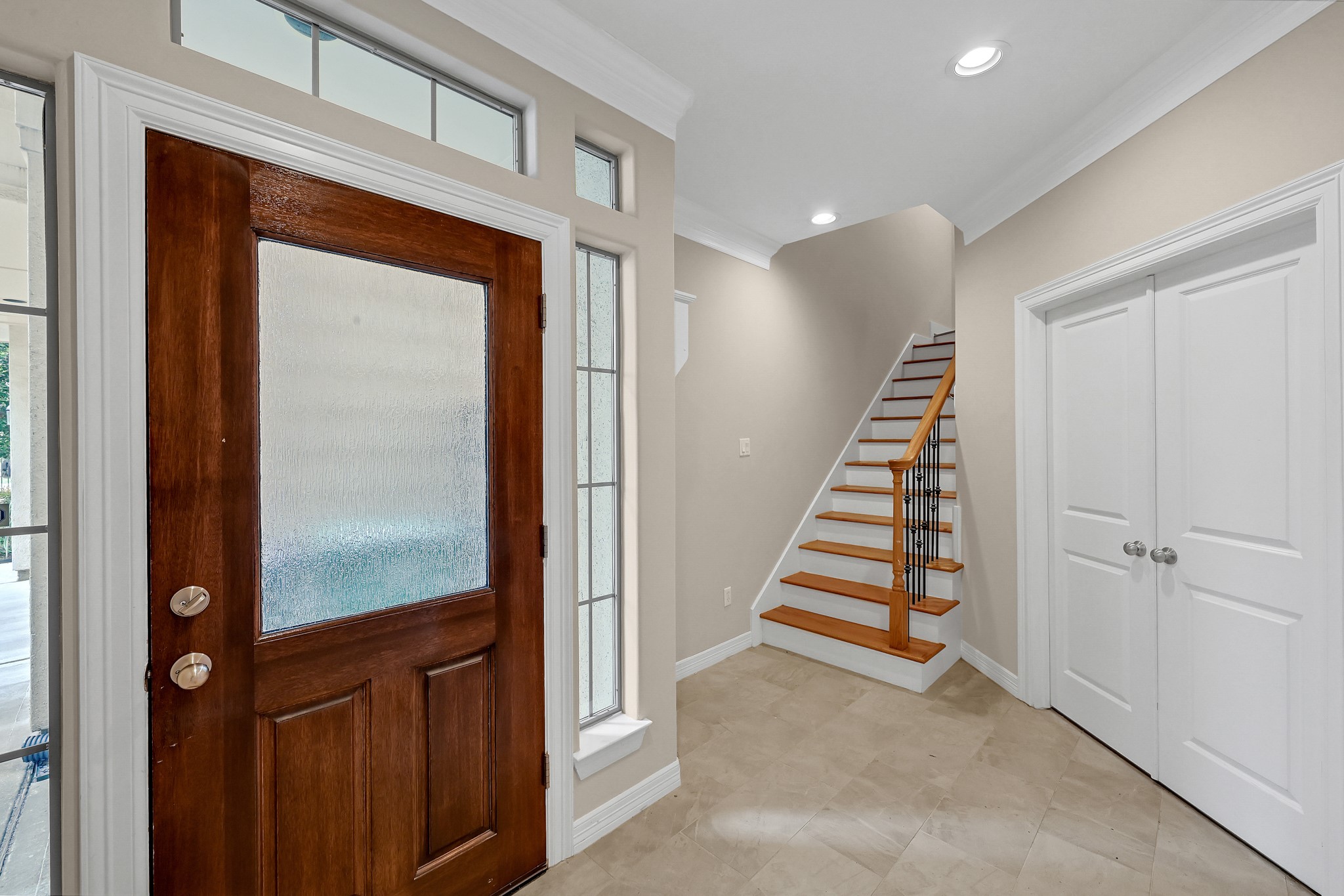 1204 Cohn Street Houston, TX 77007 - Photo 3 of 25 a view of a hallway with staircase and white walls