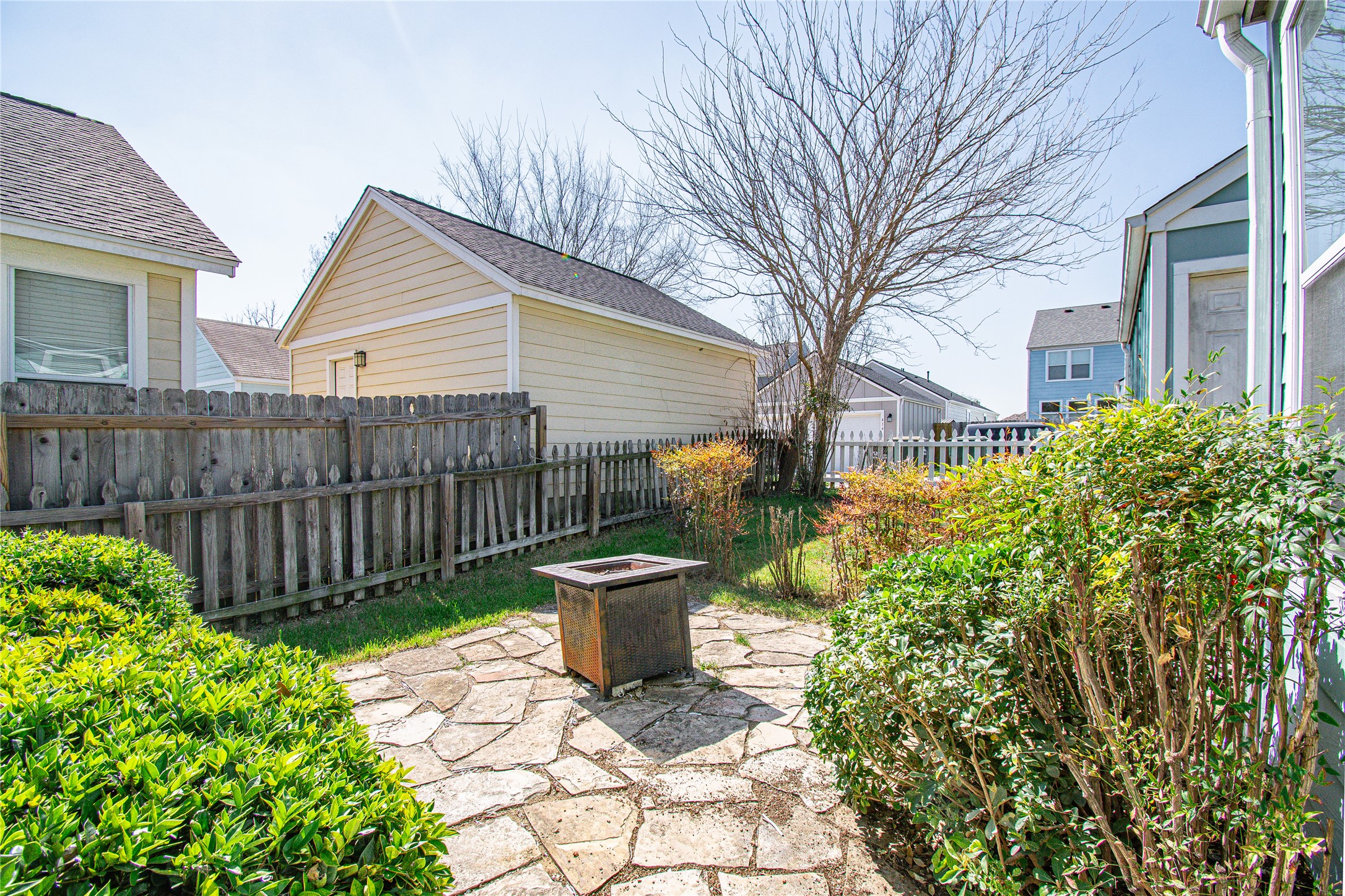 421 Shadow Point San Marcos, TX 78666 - Photo 22 of 24 Fenced backyard with a patio and a fire pit