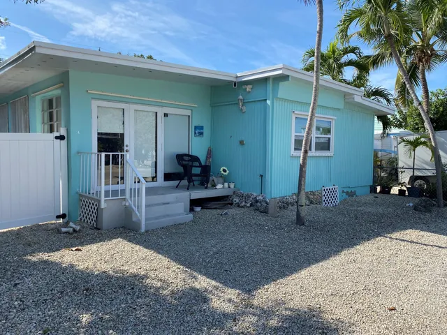 a backyard of a house with seating space