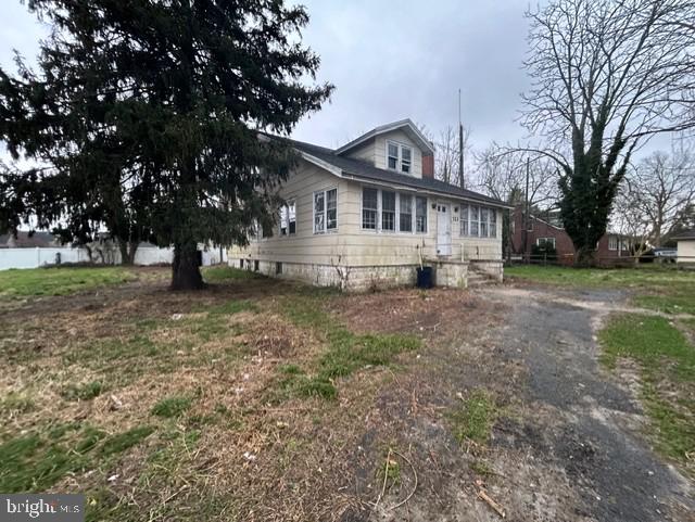 723 Chestnut Street Milton, DE 19968 - Photo 3 of 7 a view of a house with a yard