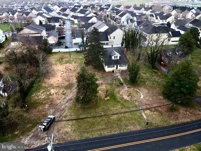 723 Chestnut Street Milton, DE 19968 - Photo 6 of 7 an aerial view of residential houses with outdoor space