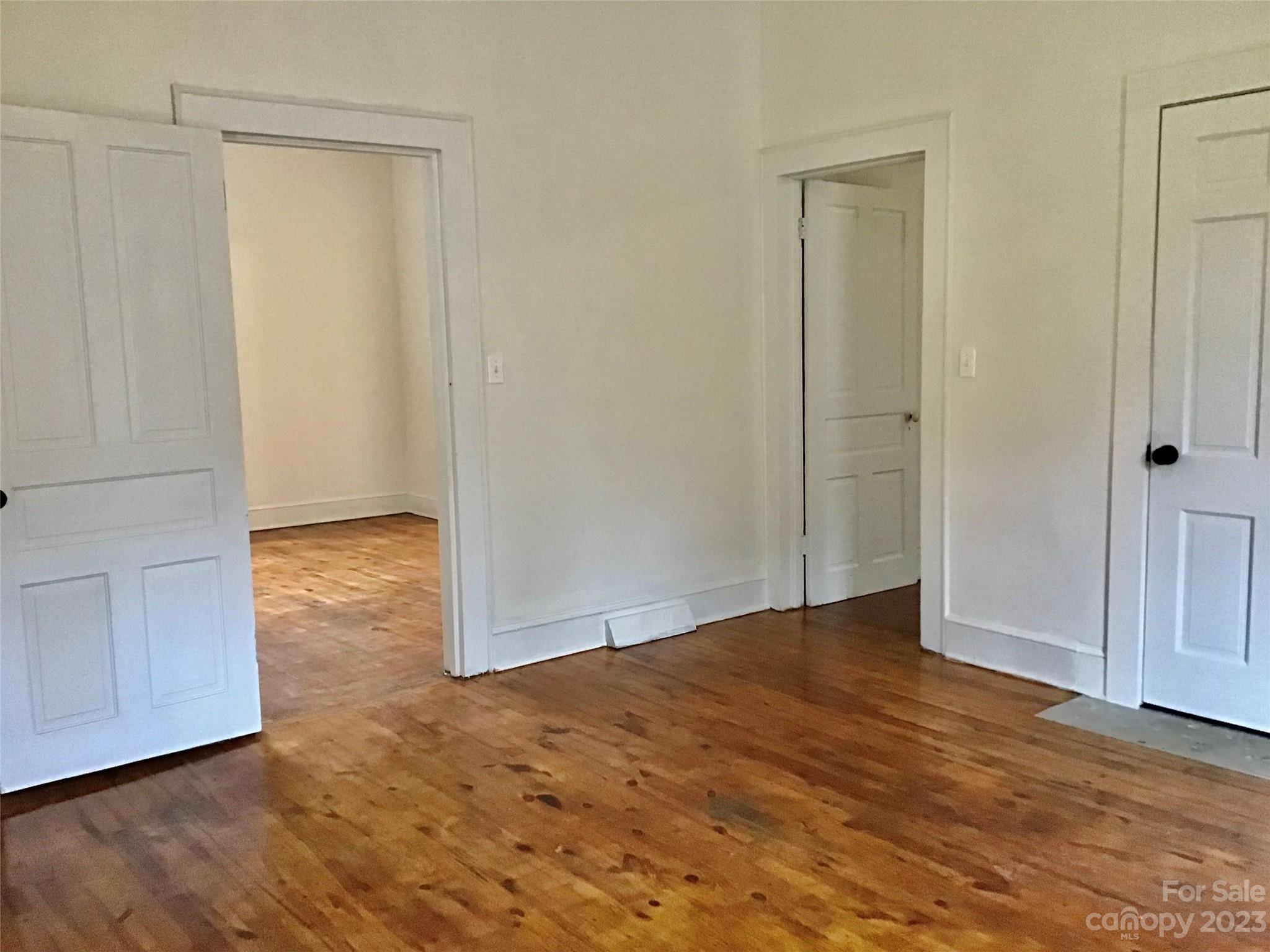 101 Alexander Road Stony Point, NC 28678 - Photo 8 of 15 a view of an empty room with wooden floor