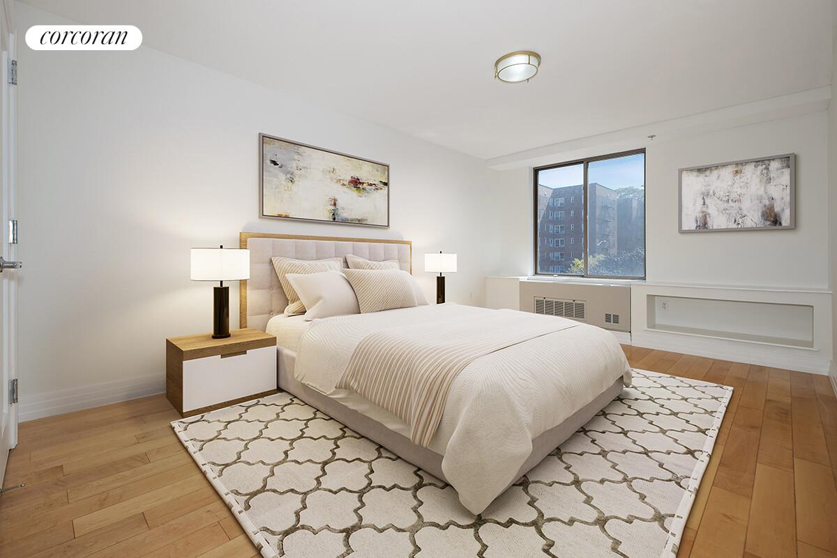 64-05 Yellowstone Boulevard, Unit 213 Queens, NY 11375 - Photo 10 of 15 a bedroom with a bed and a lamp on table