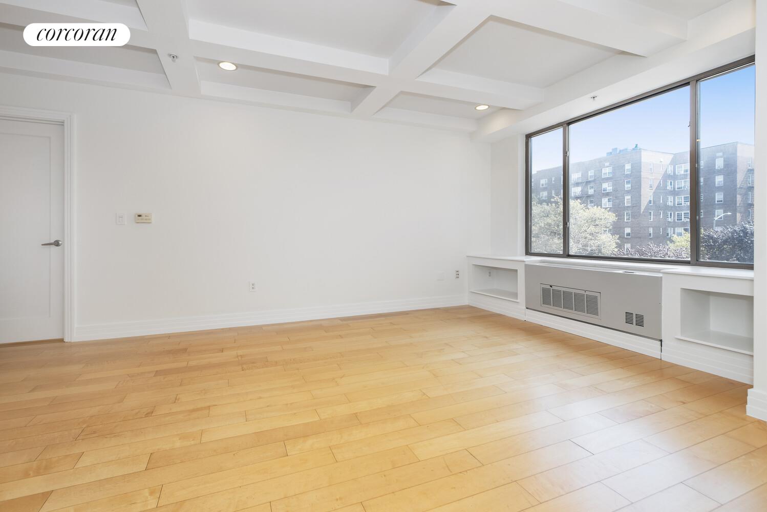 64-05 Yellowstone Boulevard, Unit 213 Queens, NY 11375 - Photo 2 of 15 a view of an empty room with a window