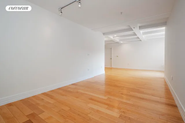 a living room with furniture a rug and a large window