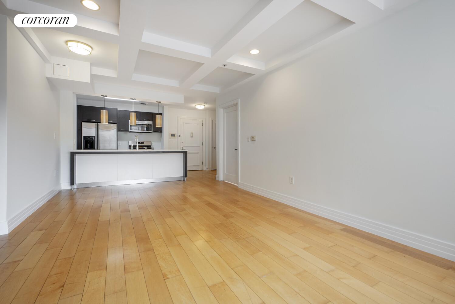 64-05 Yellowstone Boulevard, Unit 213 Queens, NY 11375 - Photo 8 of 15 a view of a kitchen with a sink and a microwave