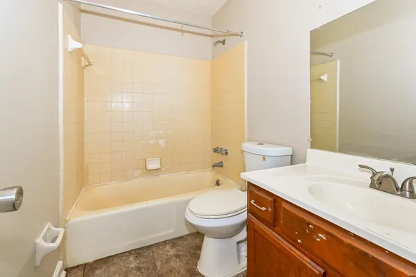 a bathroom with a sink a toilet and a bathtub