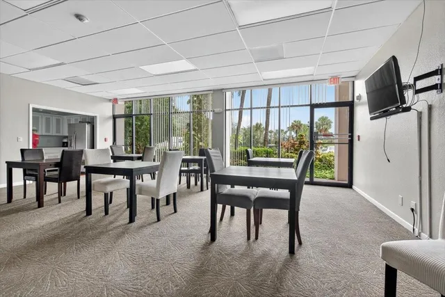 a view of a dining room with furniture window and outside view