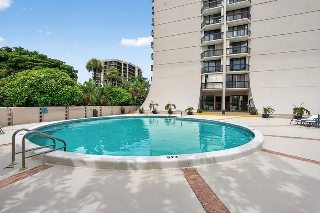 a view of outdoor space with swimming pool and outdoor seating