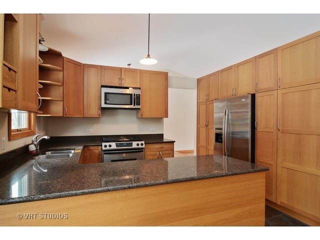239 Leith Way Cary, IL 60013 - Photo 4 of 16 a kitchen with stainless steel appliances granite countertop a sink a stove and a refrigerator